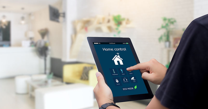 A person interacting with a tablet displaying a home automation app, managing smart home devices.